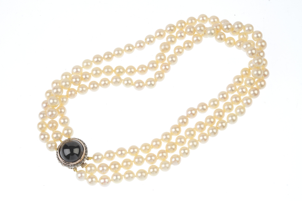 A cultured pearl three-row necklace, with garnet and rose-cut diamond clasp. The cultured pearls, - Image 3 of 3