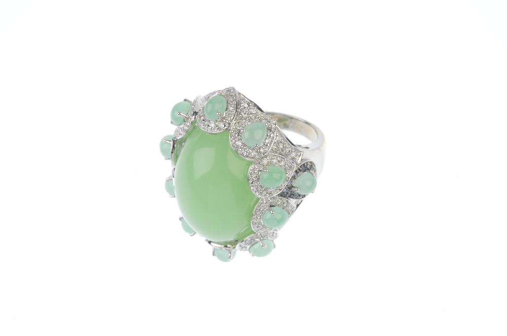 A chrysoprase and diamond dress ring. The oval chrysoprase cabochon, within a pear-shape chrysoprase - Image 2 of 3