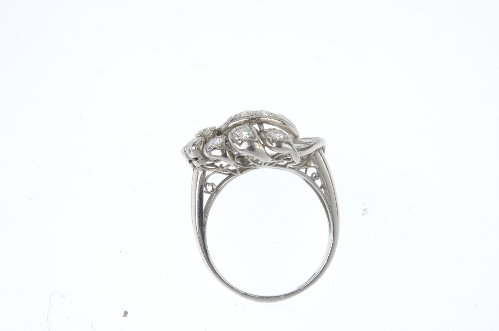 A diamond dress ring. Of openwork design, the entwined brilliant-cut diamond scrolls, with - Image 3 of 3