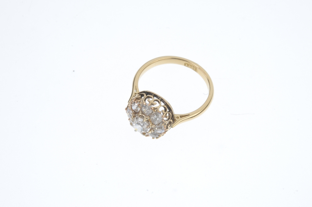 A mid 20th century 18ct gold diamond cluster ring. The old-cut diamond cluster, to the tapered - Image 2 of 3
