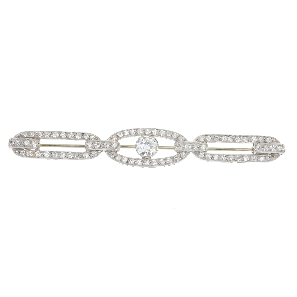 An early 20th century diamond bar brooch. The circular-cut diamond collet, within a single-cut