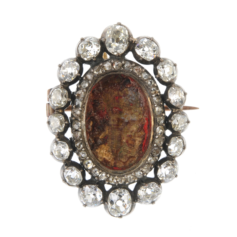 An early 19th century diamond brooch mount. The oval-shape void central panel, within a rose-cut
