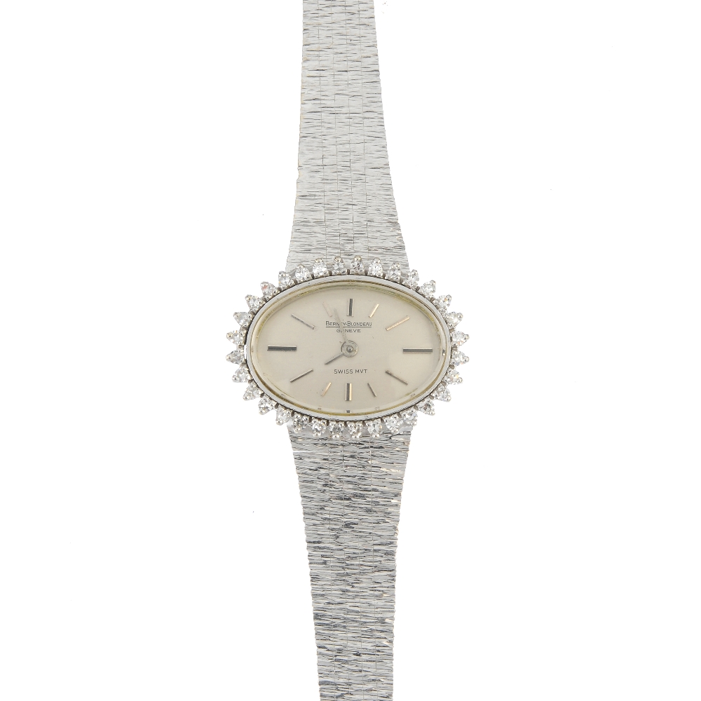 A lady's 1970s diamond cocktail watch. The oval-shape dial, with baton markers, within a single-