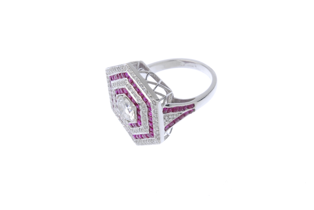 An 18ct gold diamond and ruby ring. Of hexagonal outline, the brilliant-cut diamond, within an - Image 2 of 3