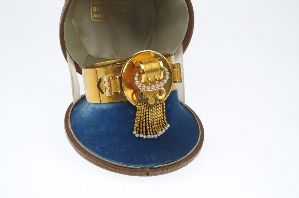 A late 19th century gold seed pearl hinged bangle. Designed as a stylised buckle, with central - Image 5 of 6