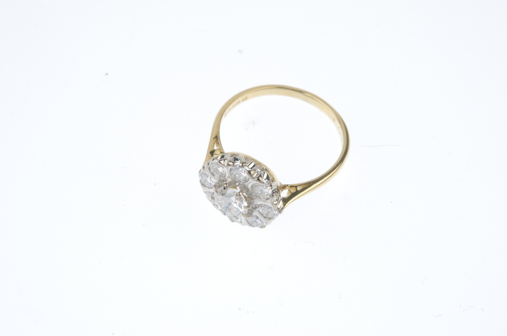 An 18ct gold diamond cluster ring. The brilliant-cut diamond, within a similarly-cut diamond - Image 2 of 3