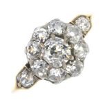 A mid 20th century gold diamond cluster ring. The old-cut diamond cluster, to the similarly-cut