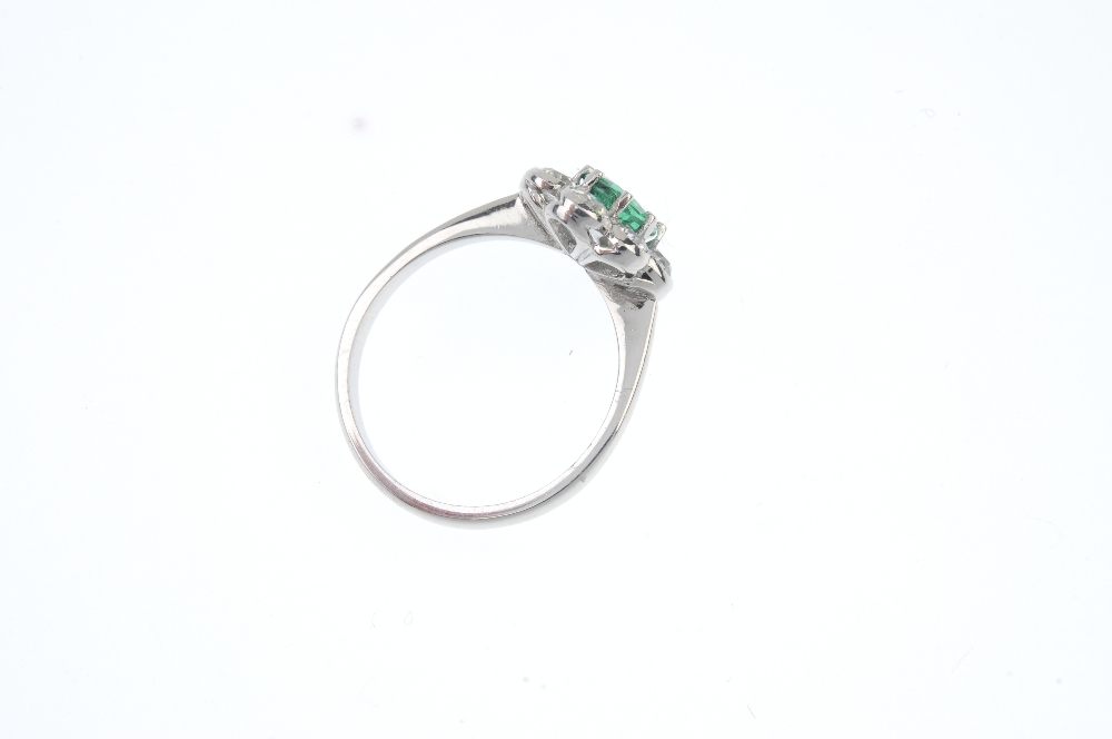 Emerald and diamond floral cluster ring. The oval-shape emerald, within an old-cut diamond scalloped - Image 3 of 3