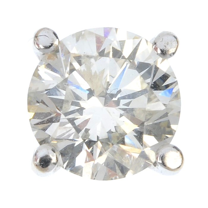 A single diamond ear stud. The brilliant-cut diamond, to the four-claw setting. Estimated diamond