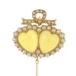 An early 20th century gold chrysoberyl and split pearl brooch. The replacement heart-shape