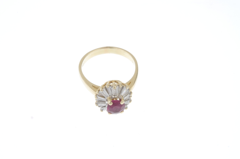 A ruby and diamond cluster ring.  The cushion-shape ruby, within a tapered baguette-cut diamond - Image 2 of 3