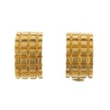 A pair of earrings. Each designed as a curved panel, with ridged decoration. Length 1.1cms. Weight