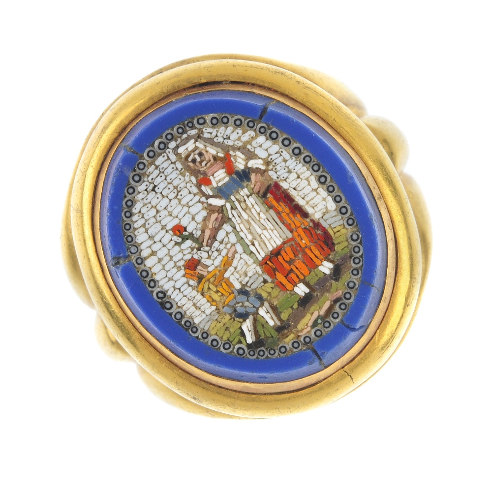 A late 19th century gold micro mosaic ring. Depicting a lady handing a red flower to a young boy,