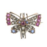A late 19th century silver and gold diamond, ruby, sapphire and split pearl butterfly brooch. The