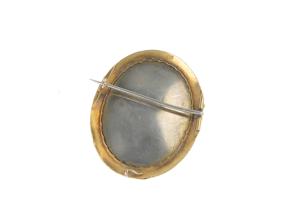 A late 19th century 18ct gold painted portrait brooch. The oval painted porcelain panel, depicting a - Image 2 of 2