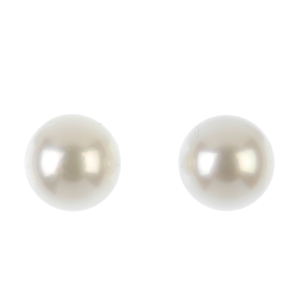A pair of cultured pearl ear studs. Cultured pearls measuring 11 and 10.9mms. Weight 4.8gms. Overall
