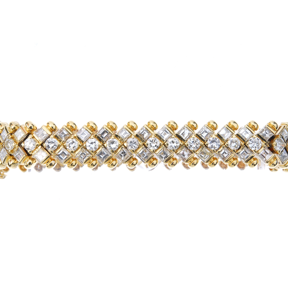A diamond bracelet. Comprising a brilliant-cut diamond line, with square-shape diamond double