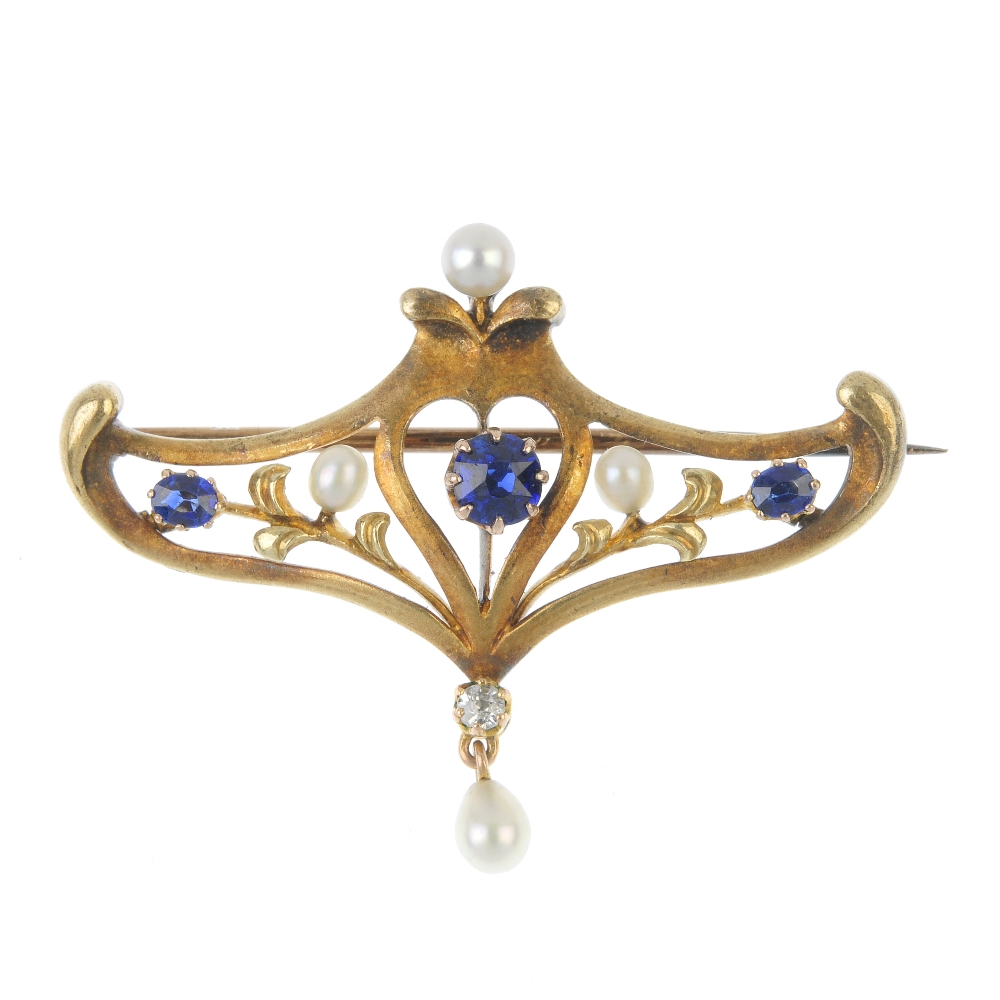 An early 20th century 14ct gold sapphire, diamond and seed pearl brooch. The circular-shape