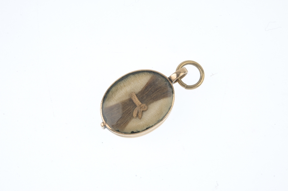 An early 19th century gold mourning pendant. Of oval outline, the painted ivory panel reading Look - Image 2 of 2