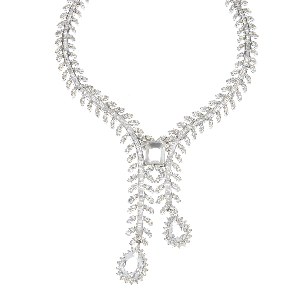 A 14ct gold rock crystal and diamond necklace. The brilliant and baguette-cut diamond articulated