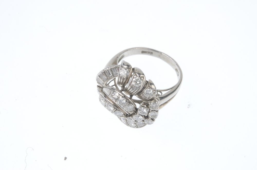 A diamond dress ring. Of openwork design, the entwined brilliant-cut diamond scrolls, with - Image 2 of 3