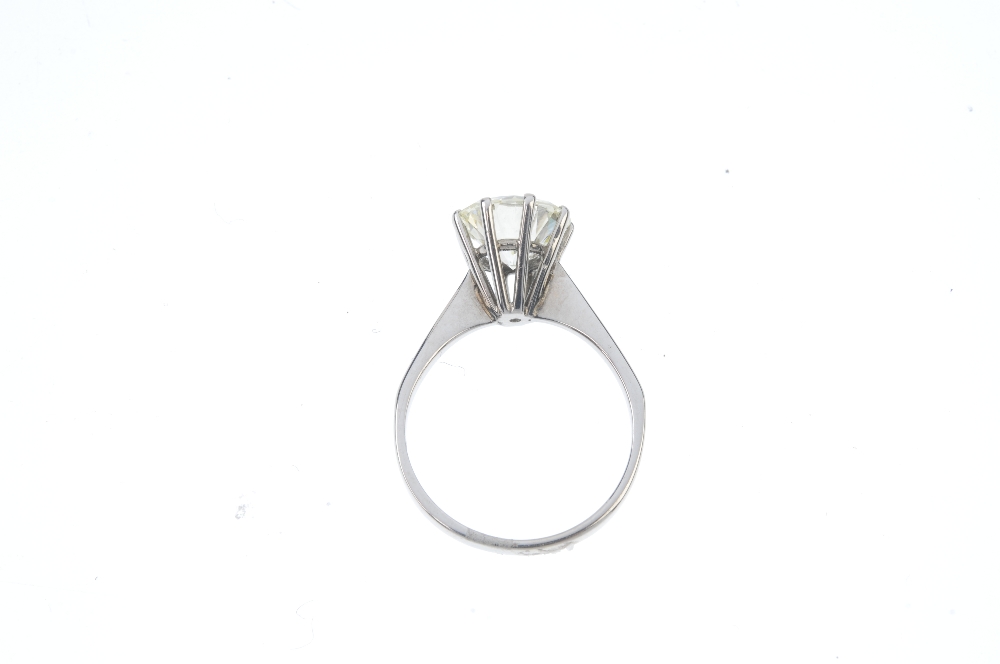 An 18ct gold diamond single-stone ring. The brilliant-cut diamond, to the tapered shoulders and - Image 3 of 5