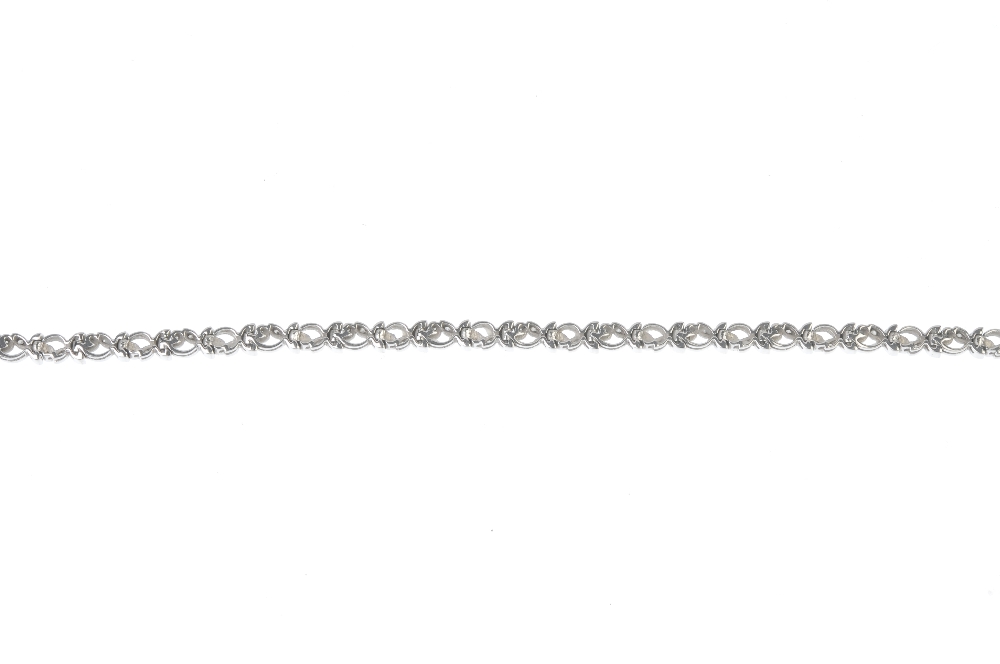 An 18ct gold diamond bracelet. Of repeating scrolling foliate design, set throughout with - Image 2 of 3