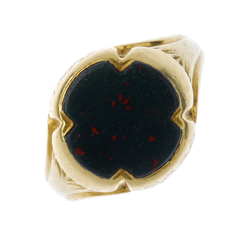 A gentleman's mid 19th century 18ct gold bloodstone signet ring. The scalloped edge bloodstone, to