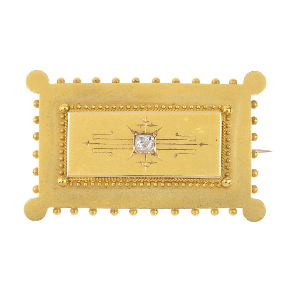 A late 19th century gold diamond brooch. Of rectangular outline, the old-cut diamond, inset to the