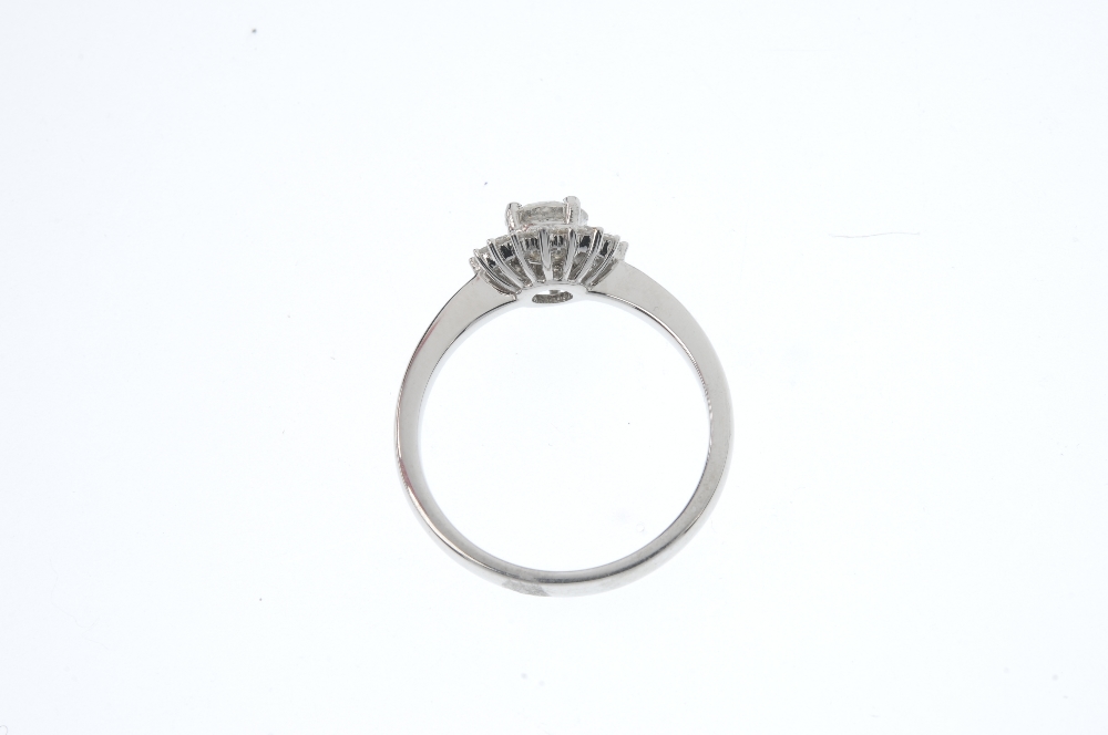 An 18ct gold diamond floral cluster ring. The brilliant-cut diamond, weighing 0.50ct, within a - Image 3 of 4