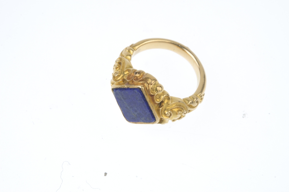 An early 20th century lapis lazuli ring. The replacement square-shape lapis lazuli, to the scrolling - Image 2 of 3