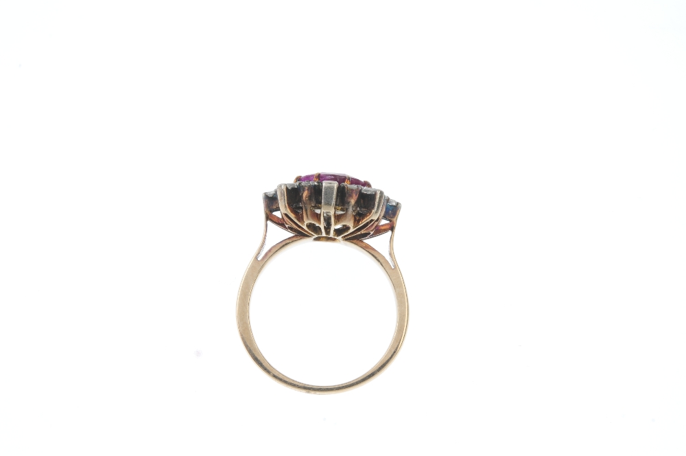 A ruby and diamond dress ring. The oval-shape ruby, with brilliant-cut diamond inset, to the - Image 3 of 3