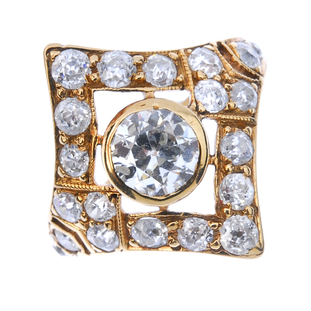 A diamond cluster ring. The old-cut diamond collet, within a similarly-cut diamond lozenge-shape