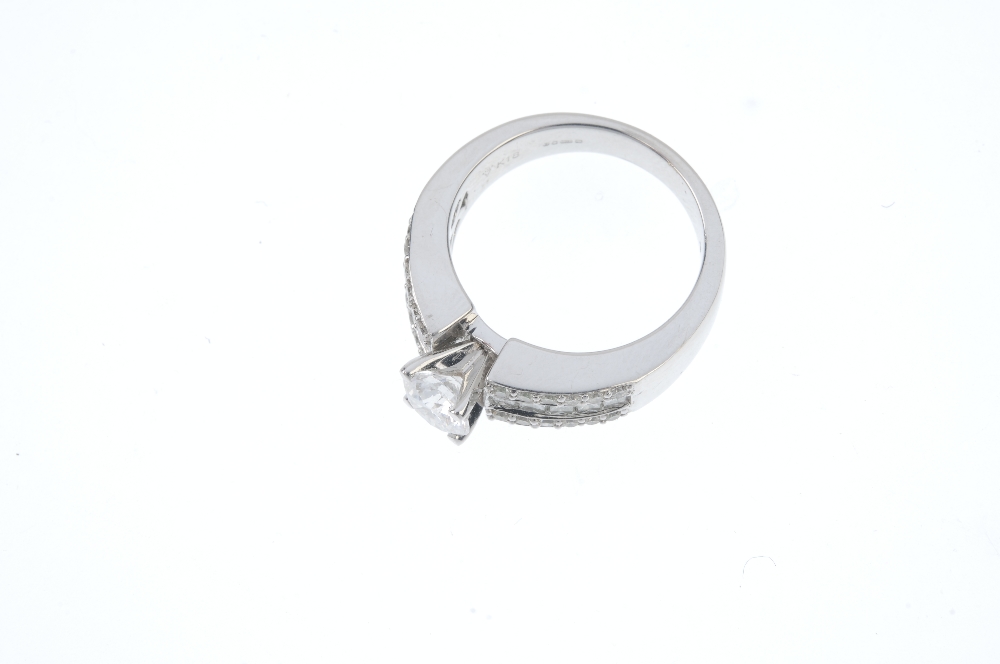 An 18ct gold diamond single-stone ring. The brilliant-cut diamond, to the similarly-cut and square- - Image 2 of 3