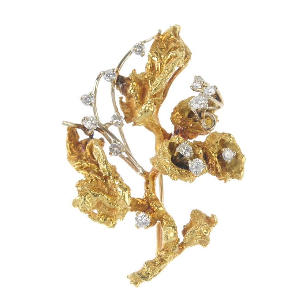A 1960s 18ct gold diamond floral spray brooch. Designed as a series of scattered brilliant-cut