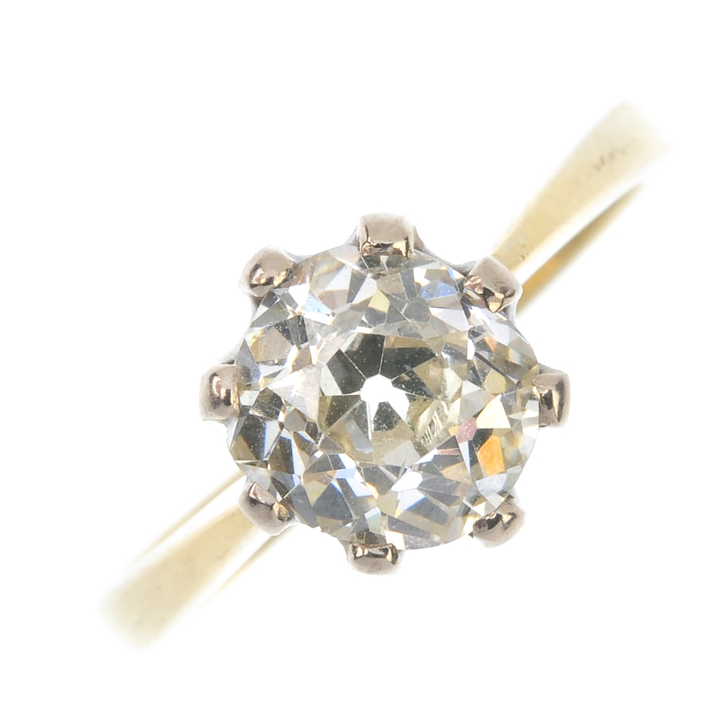 An 18ct gold diamond single-stone ring. The old-cut diamond, to the tapered bands. Estimated diamond