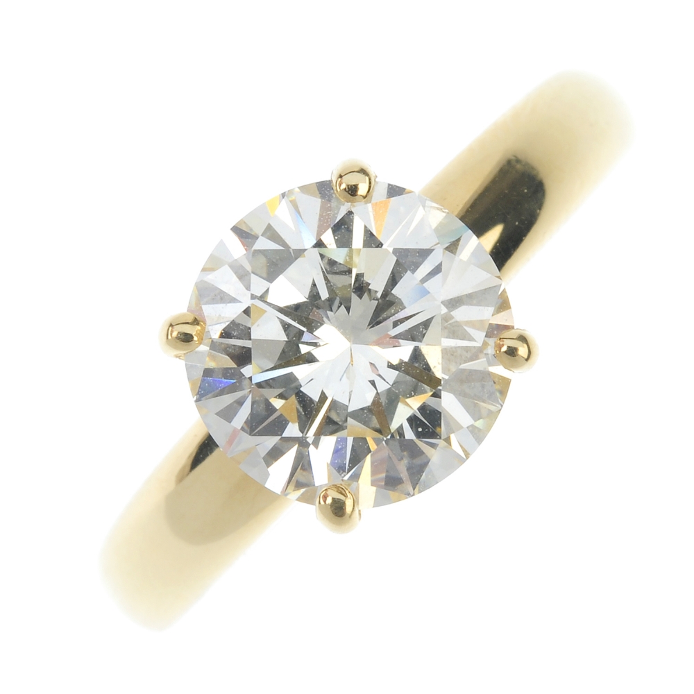 An 18ct gold diamond single-stone ring. The brilliant-cut diamond, weighing 3.44cts, to the
