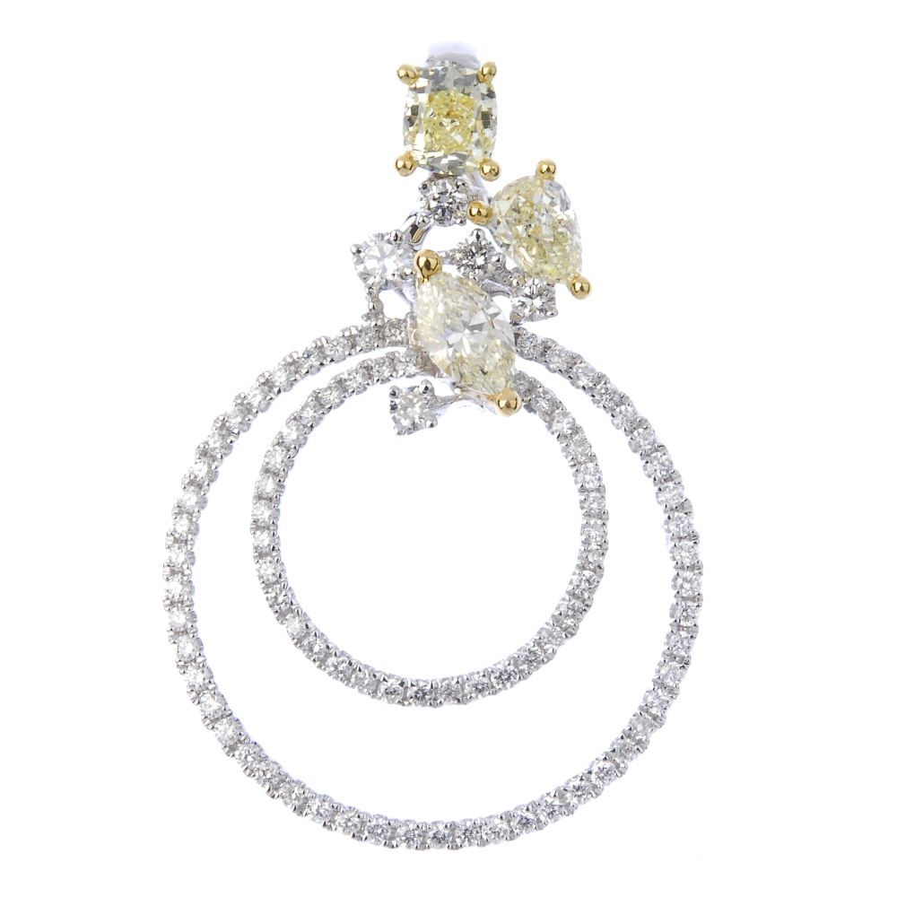 * A diamond and coloured diamond pendant. Designed as two brilliant-cut diamond concentric