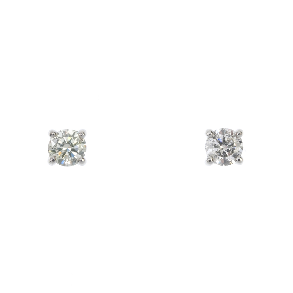 A pair of brilliant-cut diamond ear studs. Estimated total diamond weight 0.50ct, I-K colour, P2