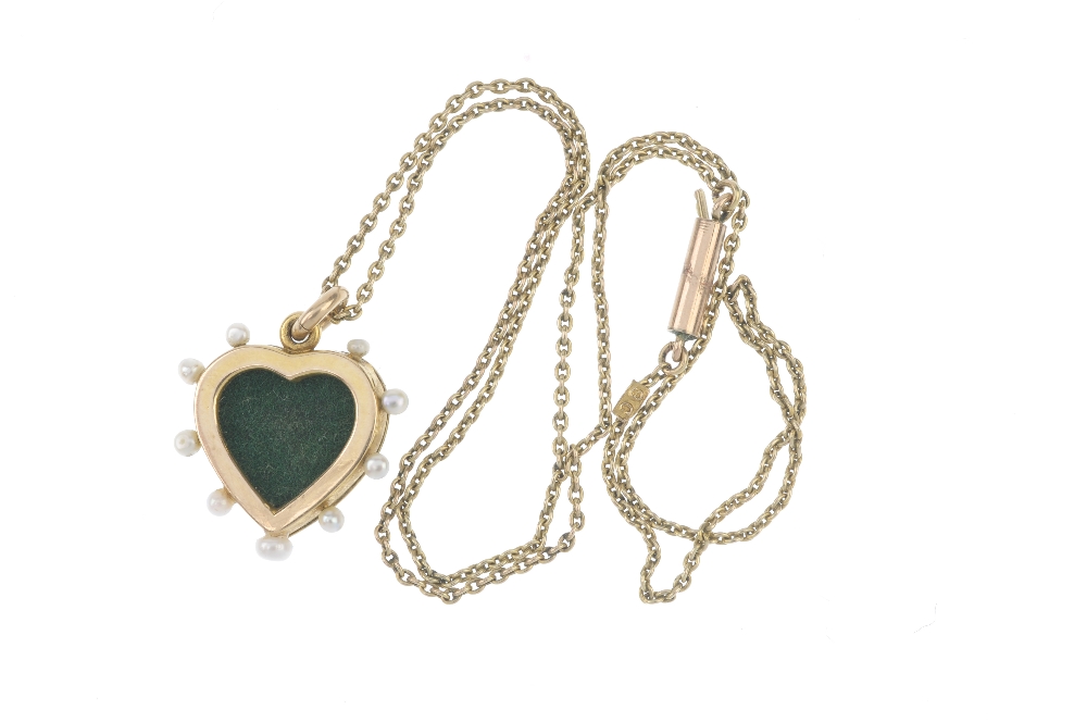 An early 20th century 9ct gold diamond, seed pearl and enamel heart pendant. The rose-cut diamond - Image 2 of 2