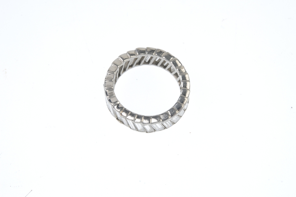 A diamond full-circle eternity ring. Designed as a baguette-cut diamond line, set at an angle. - Image 2 of 3