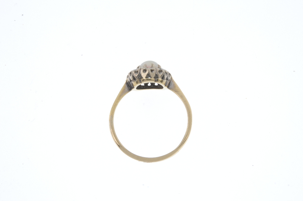 A mid 20th century 18ct gold opal and diamond cluster ring. The circular opal cabochon, within a - Image 3 of 3