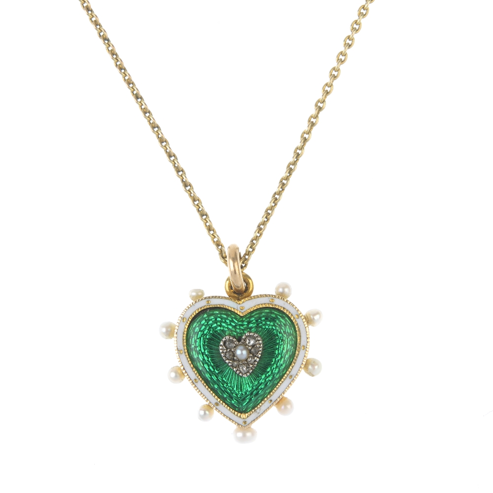 An early 20th century 9ct gold diamond, seed pearl and enamel heart pendant. The rose-cut diamond
