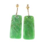 A pair of early 20th century jade ear pendants. Each designed as a rectangular-shape jadeite