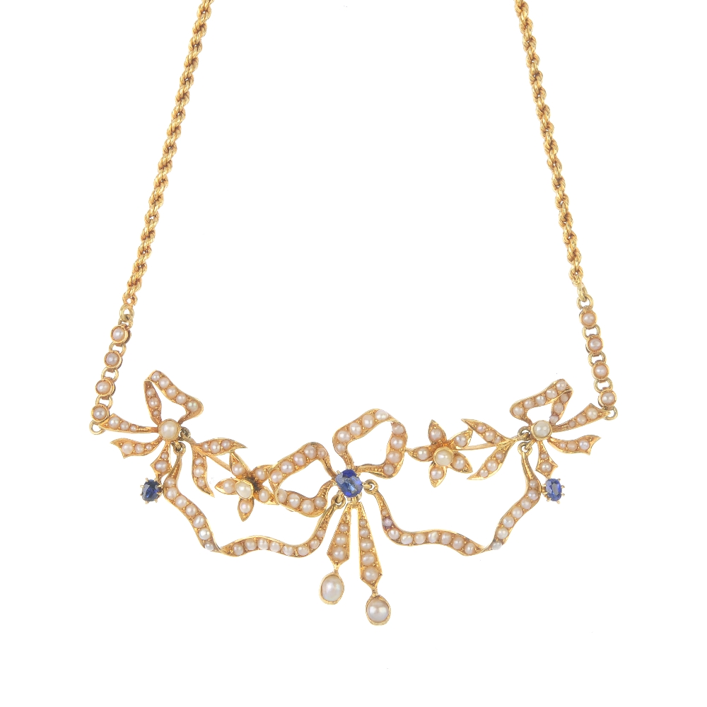 An early 20th century 18ct gold sapphire and split pearl necklace. The cushion-shape sapphire and