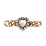 A late 19th century moonstone and split pearl composite brooch. The late 19th century heart-shape