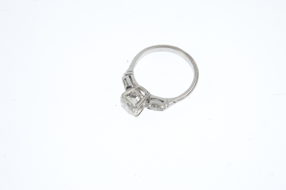 An 18ct gold diamond single-stone ring. The brilliant-cut diamond, to the marquise-shape diamond - Image 2 of 5
