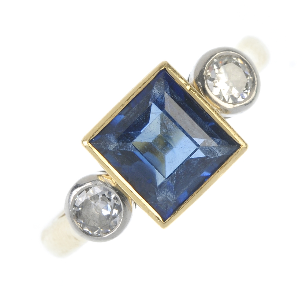 BOODLE & DUNTHORNE - an 18ct gold sapphire and diamond three-stone ring. The square-shape