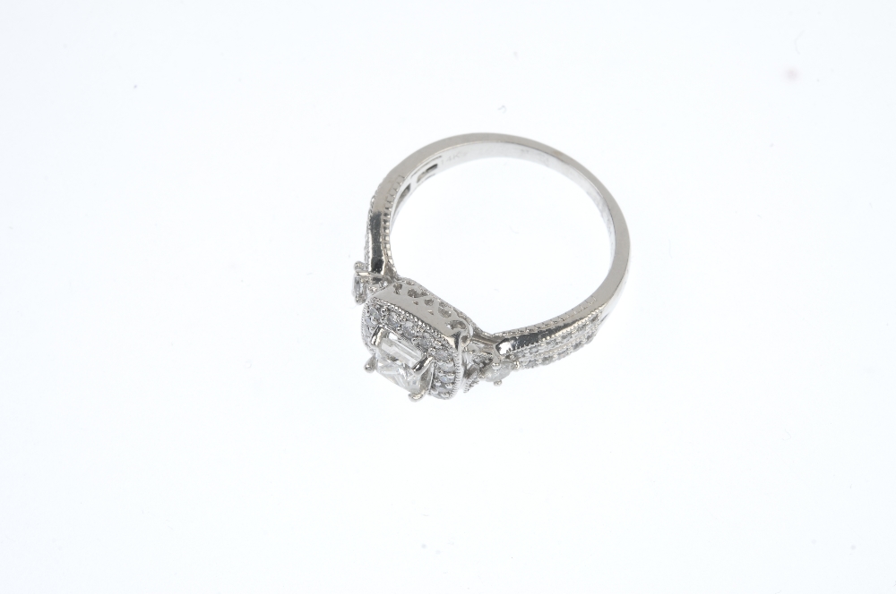 A diamond cluster ring. The square-shape diamond, within a pave-set diamond border to the pave-set - Image 2 of 3