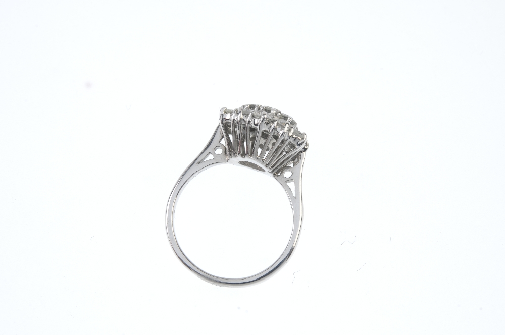 A diamond cluster ring. Designed as a brilliant-cut diamond stepped cluster, to the tapered band. - Image 3 of 3
